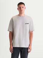 Alpinestars Latitude Oversized CSF Tee, Casual Sportswear T-shirt for Men and Women, Cement Gray, featuring a relaxed oversized fit and black ASTARS chest wordmark graphic.