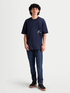 Alpinestars Institute Oversized CSF Tee, Men's Sportswear Short Sleeve T-Shirt, Navy Blue, features a small white front chest logo and relaxed oversized fit, constructed from a soft combed ring-spun cotton and polyester blend for everyday comfort.