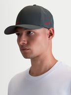 Alpinestars Points Hat, Sportswear Curved Bill Cap on Model, Dark Grey with Red Logo, Lightweight Nylon Tactel, Flex-back Fit for Everyday Comfort.