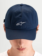 Alpinestars Dylan Dad Hat, casual sportswear cap worn by a model, blue cotton twill with curved bill and embroidered white Astars logo on the front