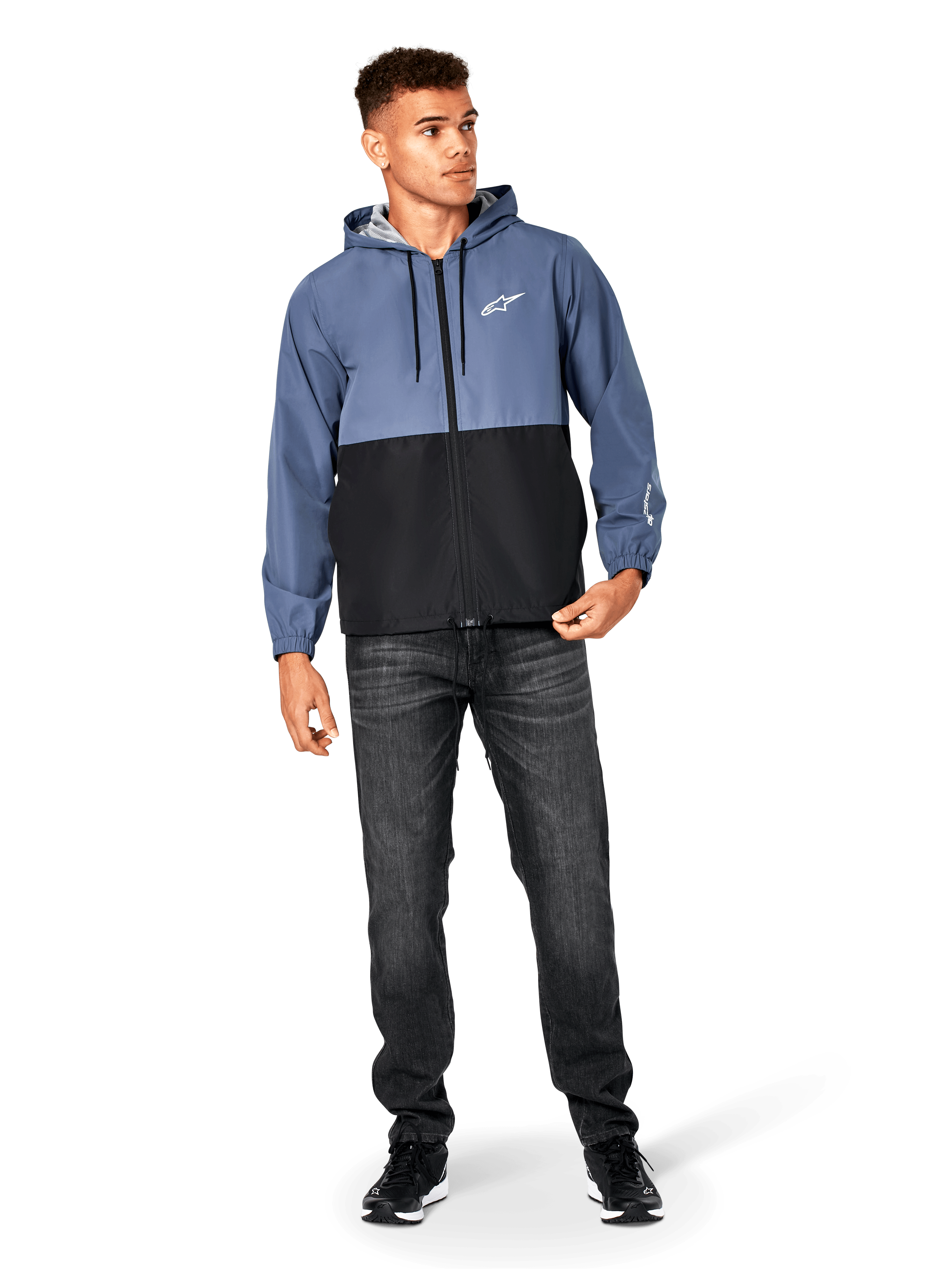 Alpinestars Speeder Windbreaker Jacket, Slate Blue and Black, hooded lightweight jacket with mesh lining, white star logo on chest, worn with black jeans and sneakers, casual motorsport streetwear design.