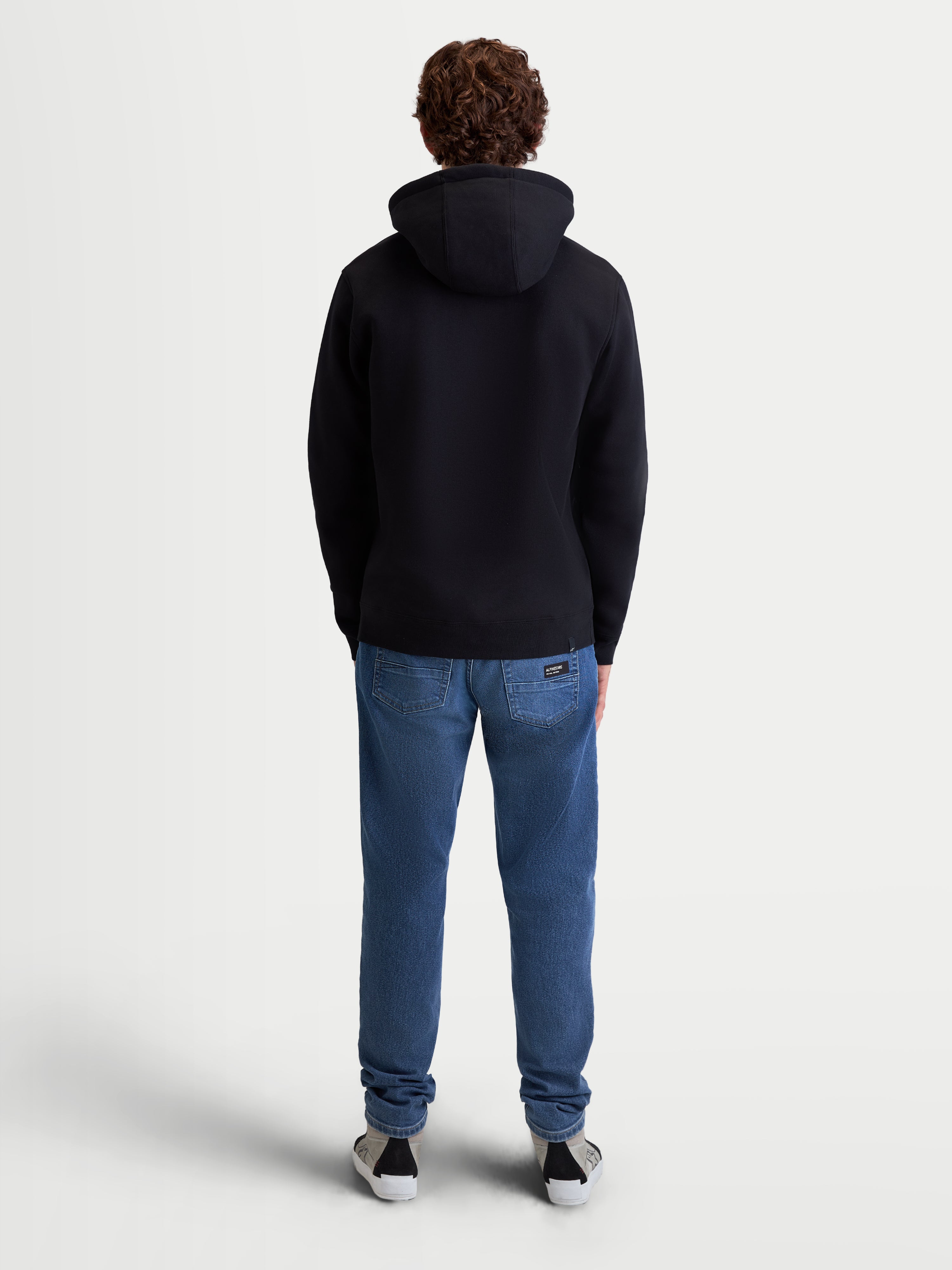 Alpinestars Ageless V3 Hoodie, Casual Sportswear Pullover, Black, Men's back view, soft cotton and recycled polyester fleece, features self-lined hood and ribbed cuffs for a premium motorsports lifestyle look
