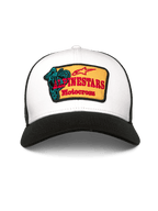 Alpinestars Hardware Trucker Hat, Trucker Cap, White and Black, featuring a yellow embroidered patch with red Alpinestars Motocross text and a teal graphic, curved bill and breathable mesh back, casual motorsport-inspired headwear