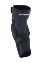 Alpinestars A-Impact Plasma Elite Knee Protector, Cycling Knee Protector, Black and White, featuring a dual strap closure system with white Alpinestars logo, mesh panels, and an ergonomic pre-curved design for MTB impact protection
