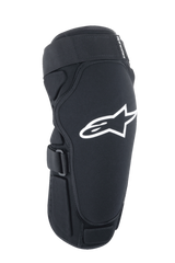 Alpinestars A-Impact Plasma Pro Knee Protector, Black and White, contoured ergonomic design with white Alpinestars logo, featuring breathable mesh fabric and adjustable hook-and-loop straps for mountain bike protection