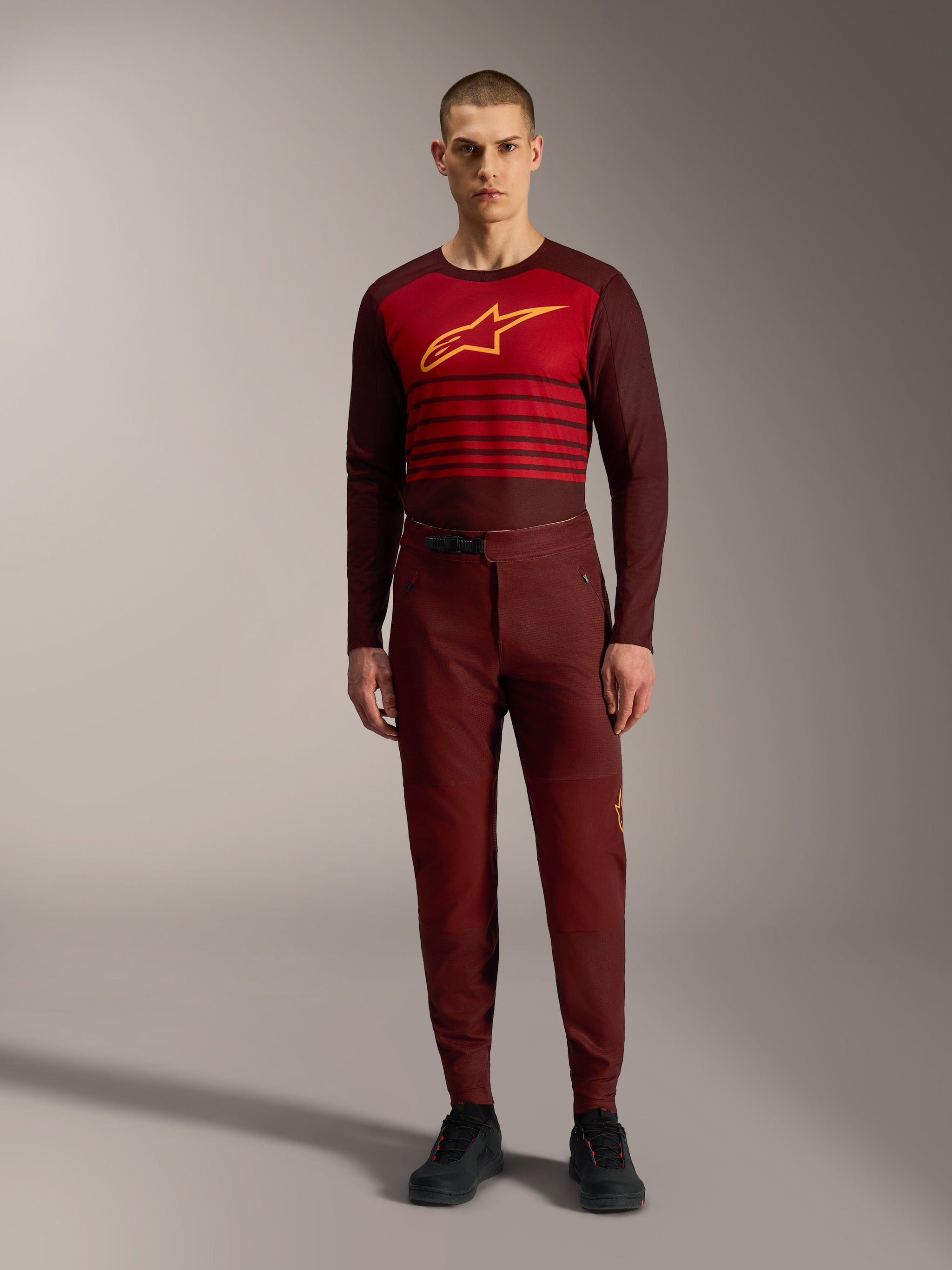 Alpinestars A-Dura Elite Flex Pants in bordeaux, performance MTB gear with a ratchet waist and flexible stretch fabric.