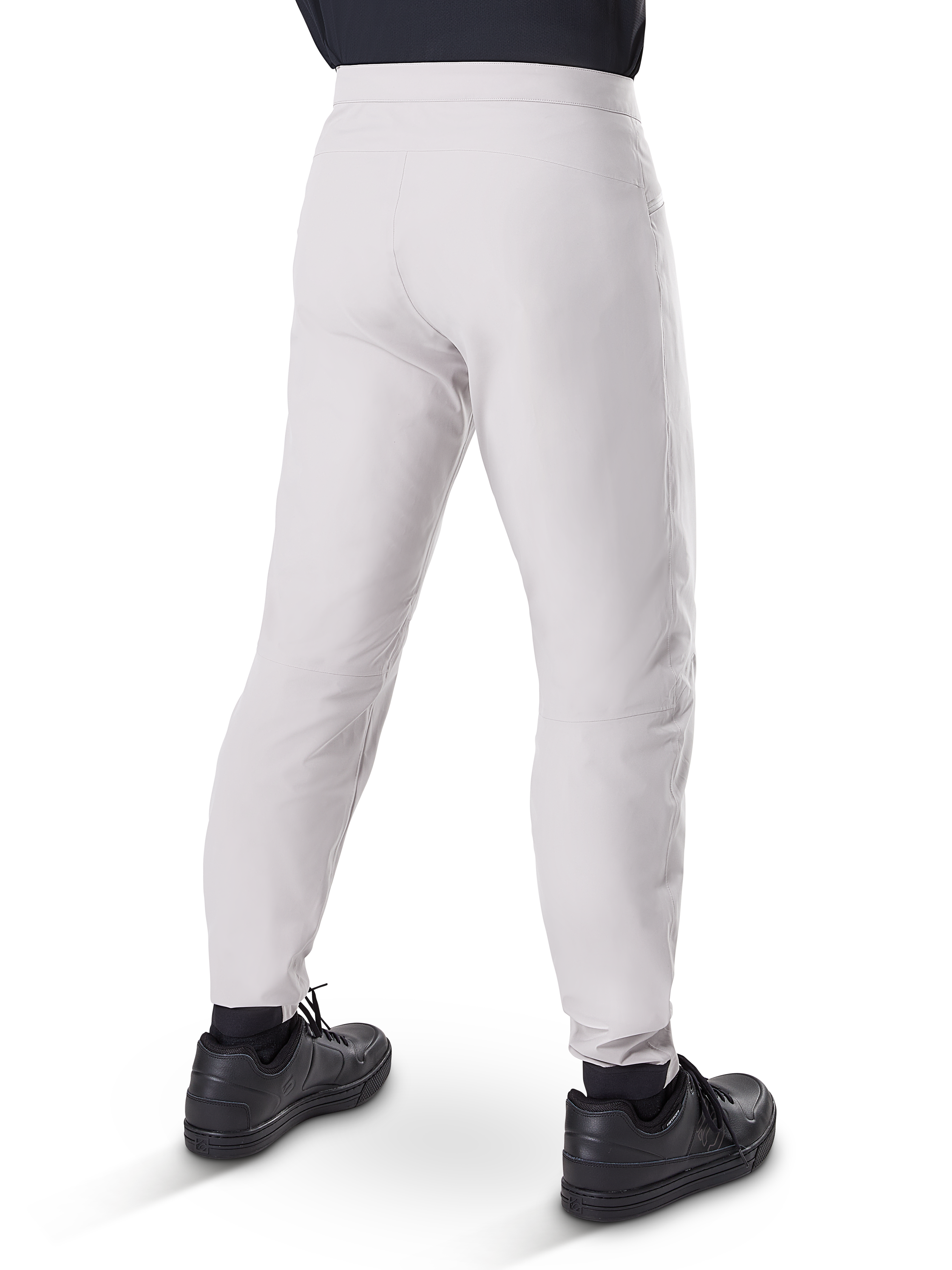 Alpinestars A-Dura Waterproof Pants, MTB Cycling Pants, Titanium Gray, rear view showing tapered legs and elasticated cuffs, worn with black shoes, waterproof technical gear for mountain biking