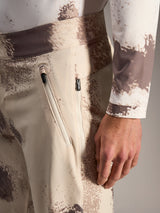 Alpinestars A-Dura Ride Shorts in sand camo, featuring zippered pockets and durable stretch fabric for MTB riding.