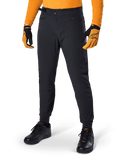 Alpinestars A-Dura Pants, Mountain Bike Pants, Black, side waist cinches and zippered pockets, worn with orange jersey and gloves, sporty regular fit for MTB riding