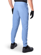 Alpinestars A-Dura Pants, Mountain Bike Pants, Infinity Blue, back view showing regular fit and elasticated cuffs, worn with black gloves and black footwear, durable 2-way stretch cycling apparel.