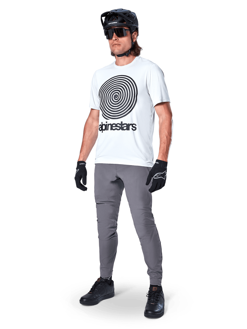 Alpinestars A-Dura Pants, MTB Pants, Dark Gray, worn with white spiral graphic t-shirt, black MTB helmet, sunglasses, and black gloves, durable 2-way stretch textile for off-road cycling