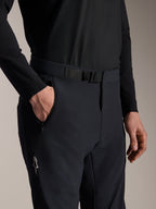 Alpinestars A-Aria Elite Pants, MTB Pants, Black Titanium, close-up view of the magnetic buckle closure and zippered pocket, featuring laser-perforated ventilation and white Alpinestars logo, technical mountain bike gear.