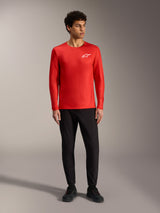 A-Dura Air Long Sleeve Red MTB Jersey by Alpinestars, featuring a white chest logo and breathable jacquard mesh fabric.