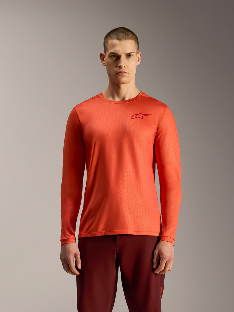Orange A-Dura Air Long Sleeve Jersey, breathable moisture-wicking MTB top featuring a small red Astars chest logo.