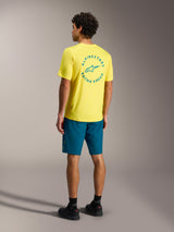 Alpinestars A-Dura Ride Shorts in blue green with a yellow jersey, rear view of mountain bike performance gear.