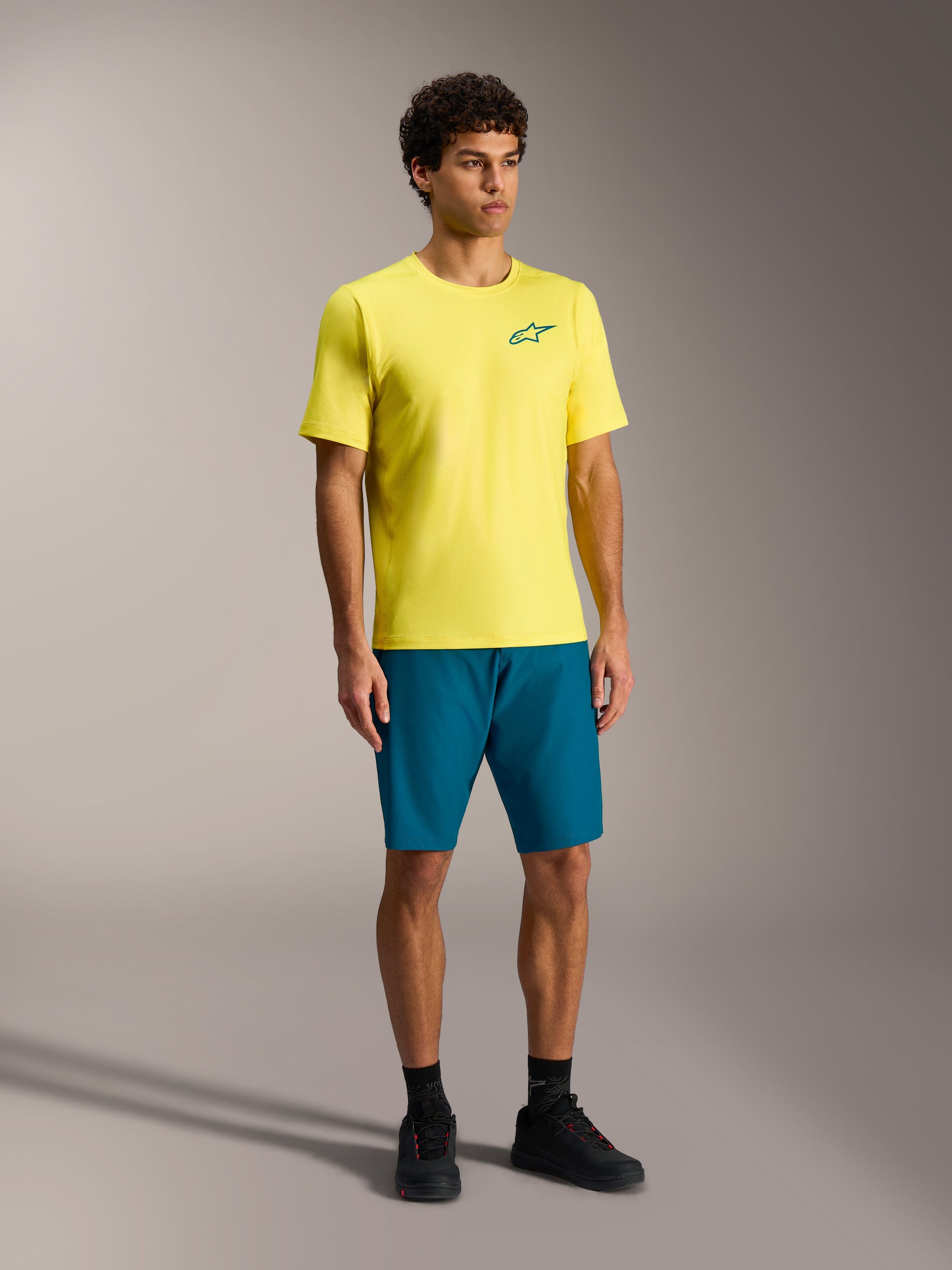 Alpinestars A-Dura Ride Shorts in blue-green and yellow jersey, durable performance mountain bike apparel for men.