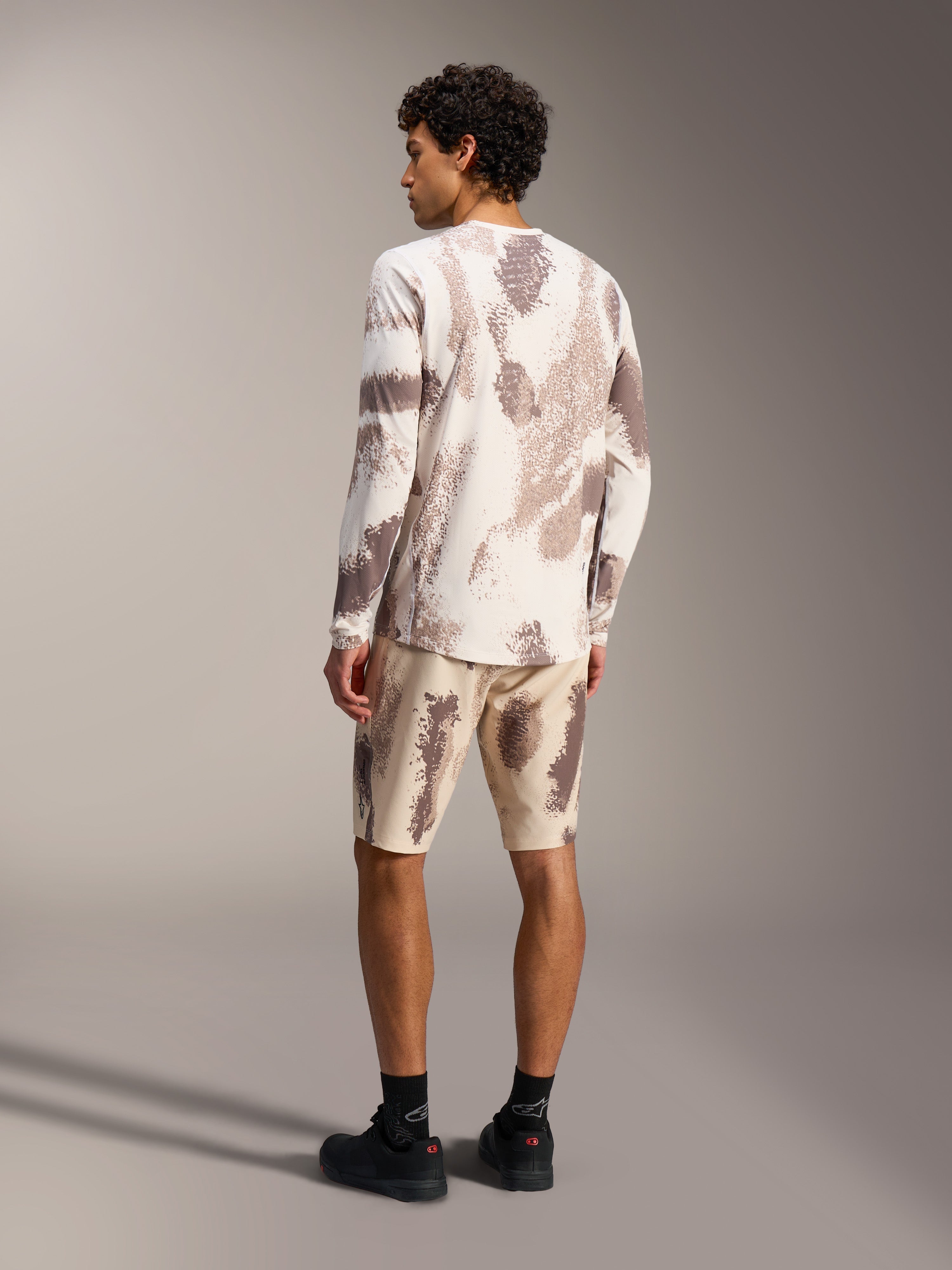 A-Dura Ride LS Jersey and matching Shorts in Sand Camo, technical mountain bike gear with a textured camouflage pattern.