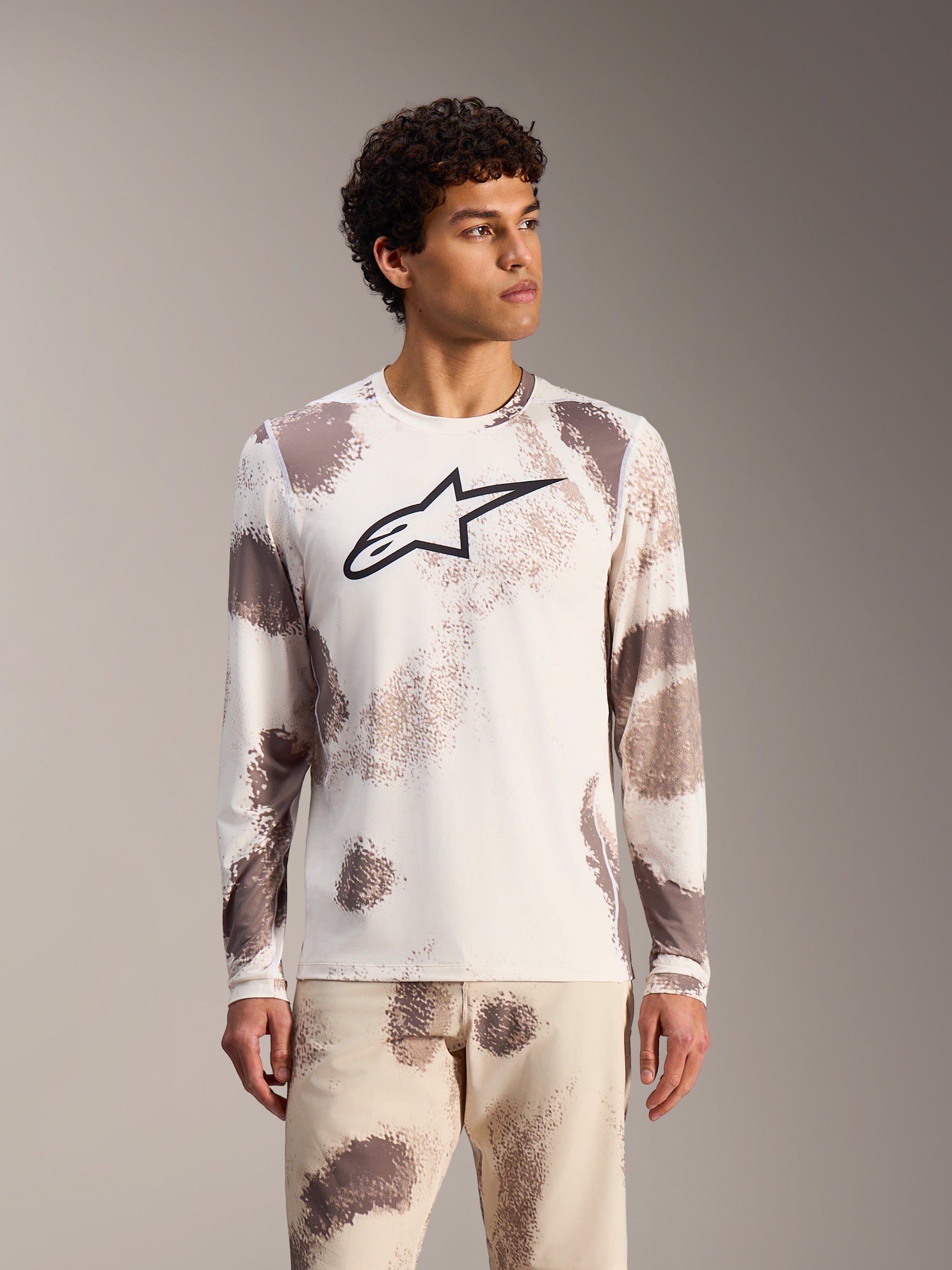 Alpinestars A-Dura Ride Long Sleeve Jersey in Sand Camo, white MTB top with abstract patterns and a black chest logo.