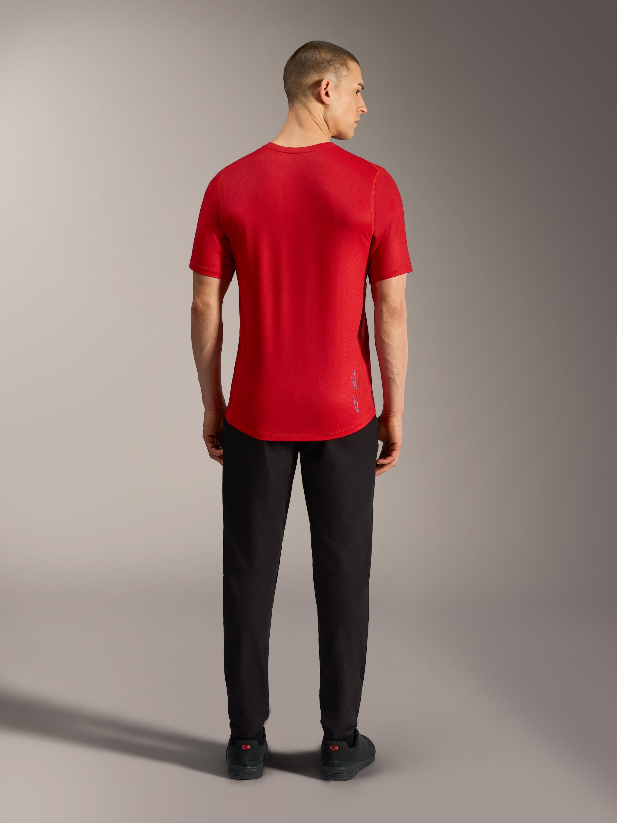 Red A-Dura Ride Short Sleeve Jersey, back view, featuring a dropped tail and lightweight performance fabric for MTB.