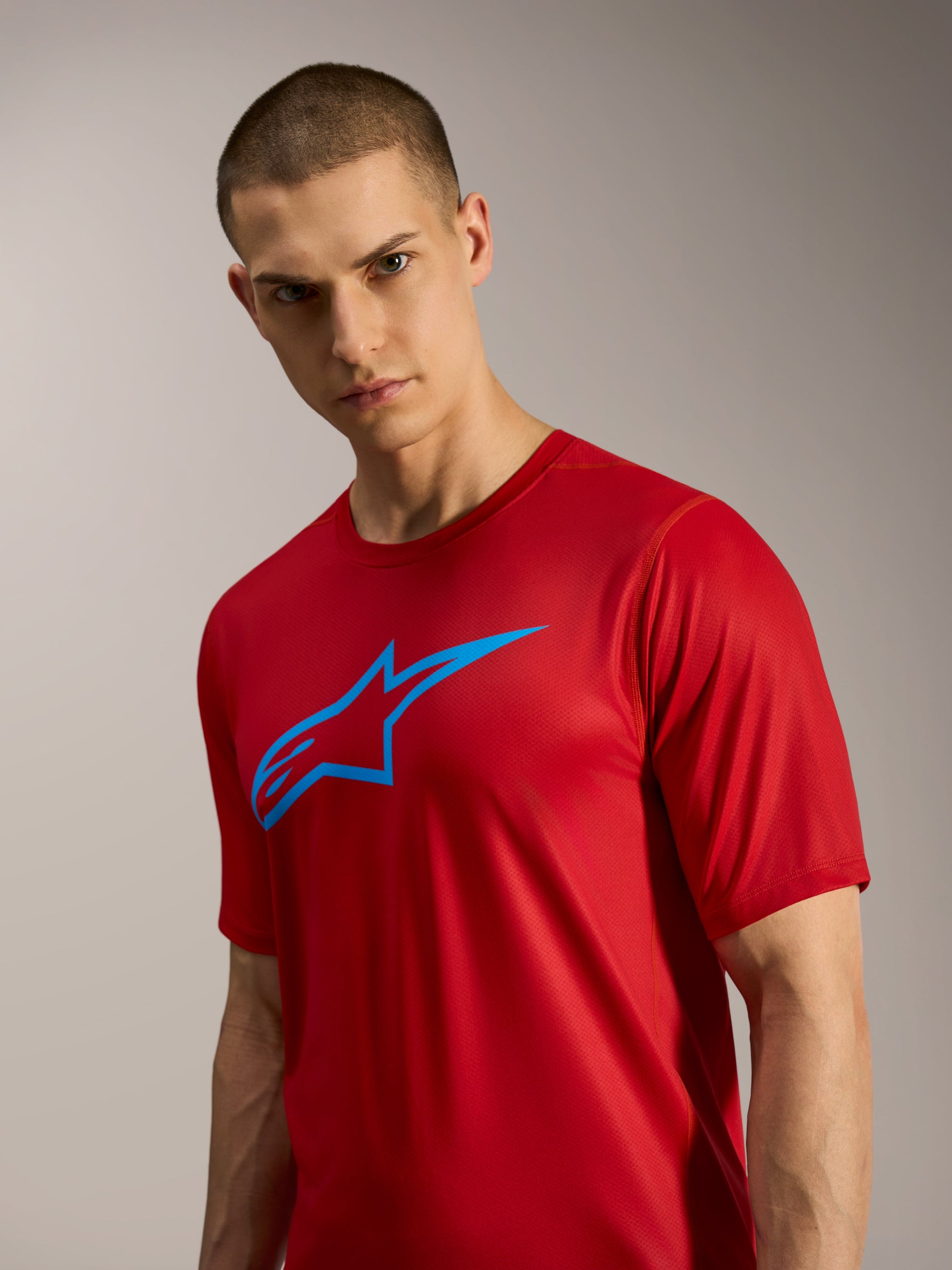 Red A-Dura Ride Short Sleeve Jersey with blue Astars logo, lightweight performance MTB gear for casual trail riding.