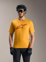 Orange A-Dura Ride Short Sleeve Jersey featuring a red Astars logo, styled with a mountain bike helmet and gloves.