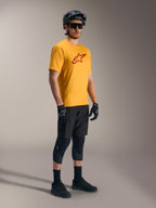 Orange A-Dura Ride Short Sleeve Jersey featuring a red Astars logo, paired with black mountain bike gear and helmet.