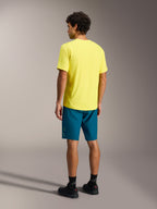 Yellow A-Dura Ride SS Jersey and blue green A-Dura Ride Shorts, Alpinestars mountain bike apparel shown from the rear.