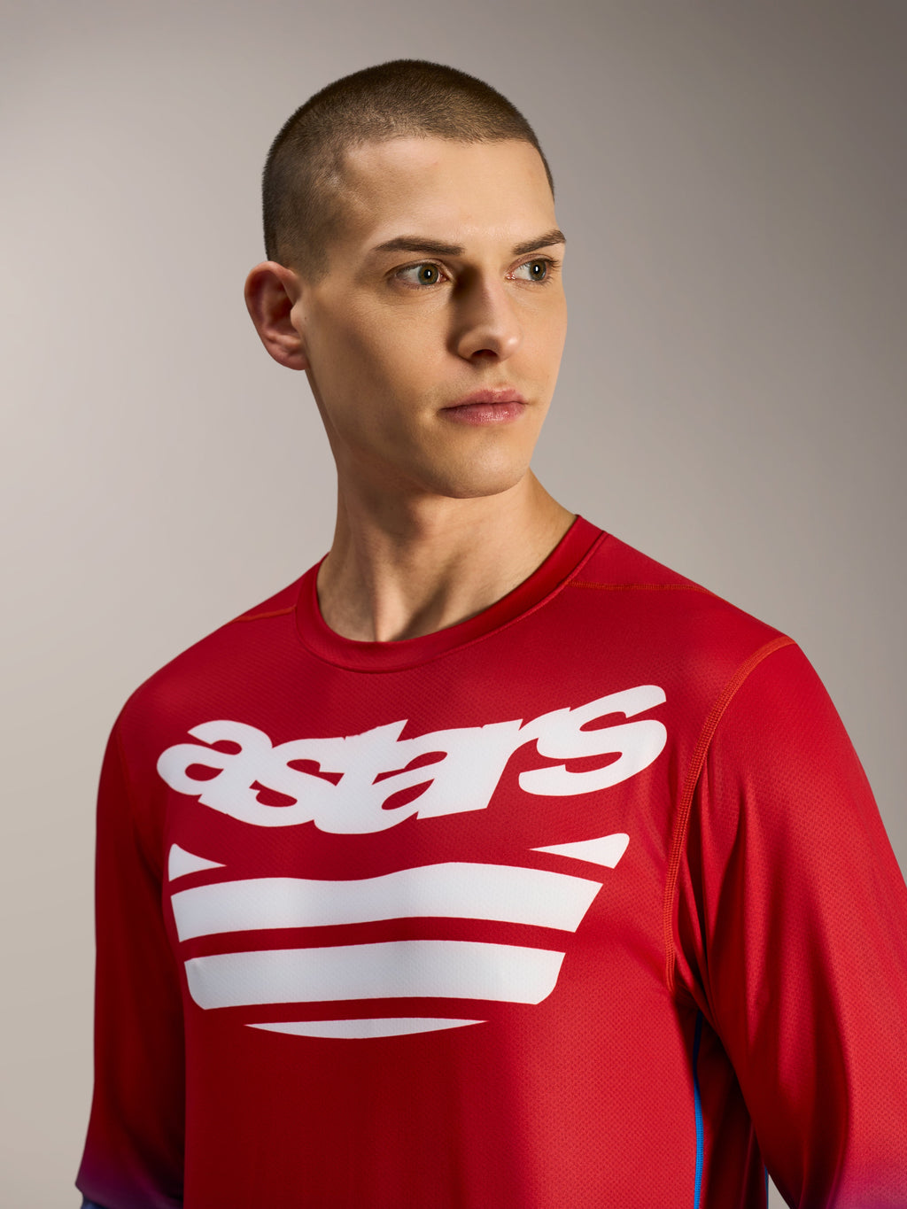 A-Dura ASTARS Jersey 2.0, long sleeve MTB jersey in bright red and blue with white logo graphics on the chest.
