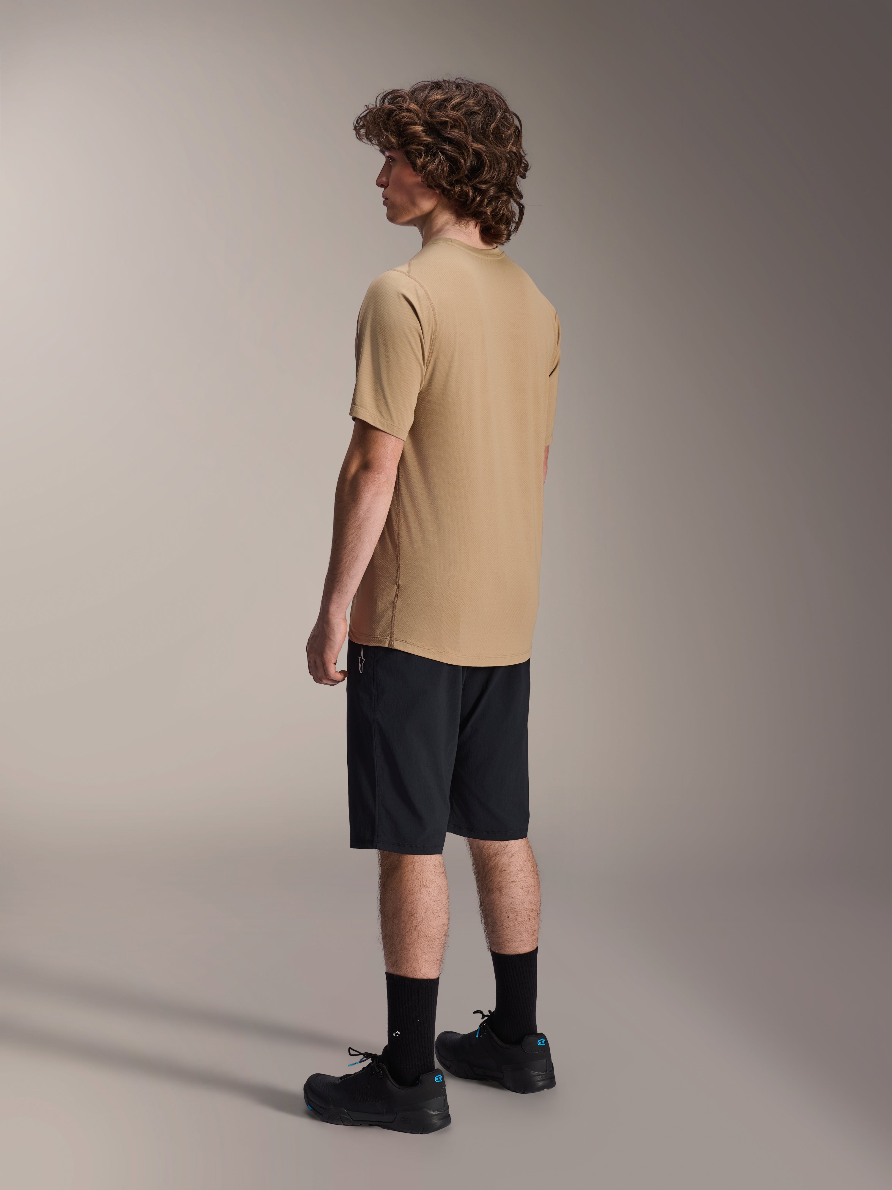 Alpinestars A-Dura Astar Short Sleeve Jersey, Light Brown, worn with black shorts and black socks, jacquard moisture-wicking fabric, casual mountain bike performance apparel
