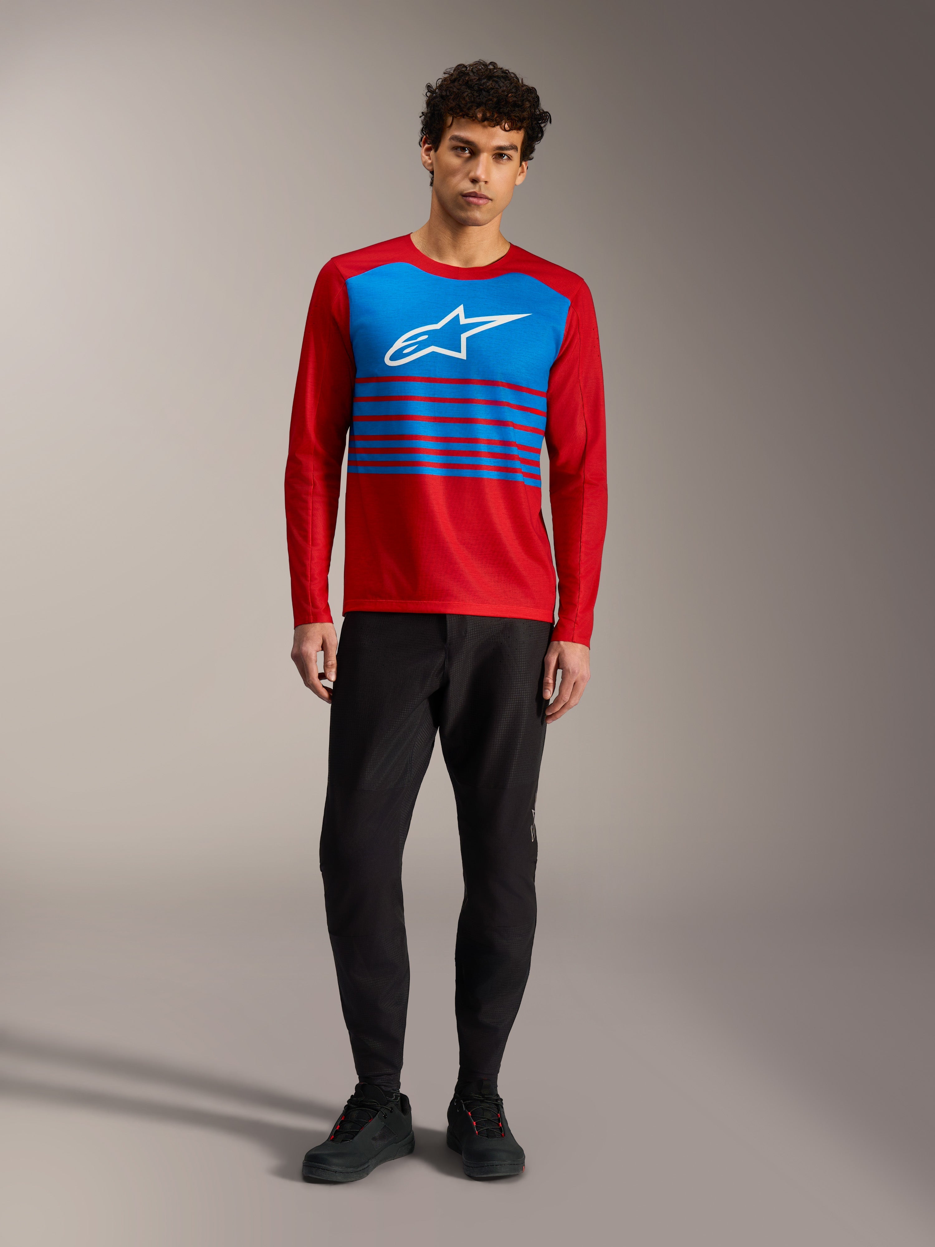 A-Dura Elite Jersey 2.0, red long sleeve MTB top with blue chest panel, white Alpinestars logo, and striped accents.