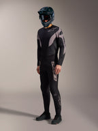A-Supra Elite MTB kit in black and grey, featuring performance stretch pants and jersey with bold Alpinestars branding.