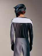 A-Supra Elite Jersey in Faded Gray, rear view featuring white upper panel, micro-perforated fabric, and centered ASTARS logo.