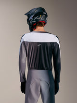 A-Supra Elite Jersey in Faded Gray, rear view featuring white upper panel, micro-perforated fabric, and centered ASTARS logo.