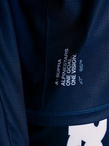 Blue A-Supra Elite MTB Jersey close-up, featuring micro-perforated fabric and the One Goal One Vision racing slogan.