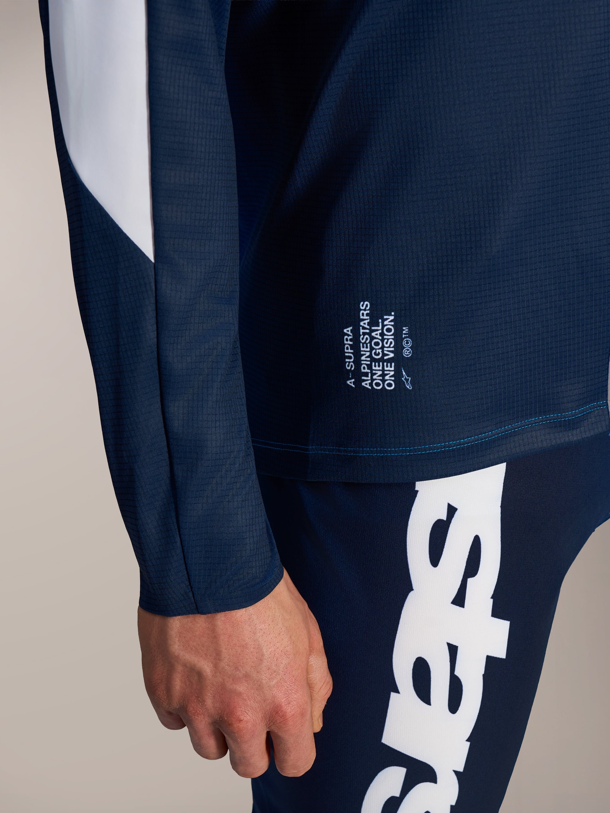 Alpinestars A-Supra Elite Jersey in Faded Bright Blue, showing the slogan and micro-perforated MTB performance fabric.