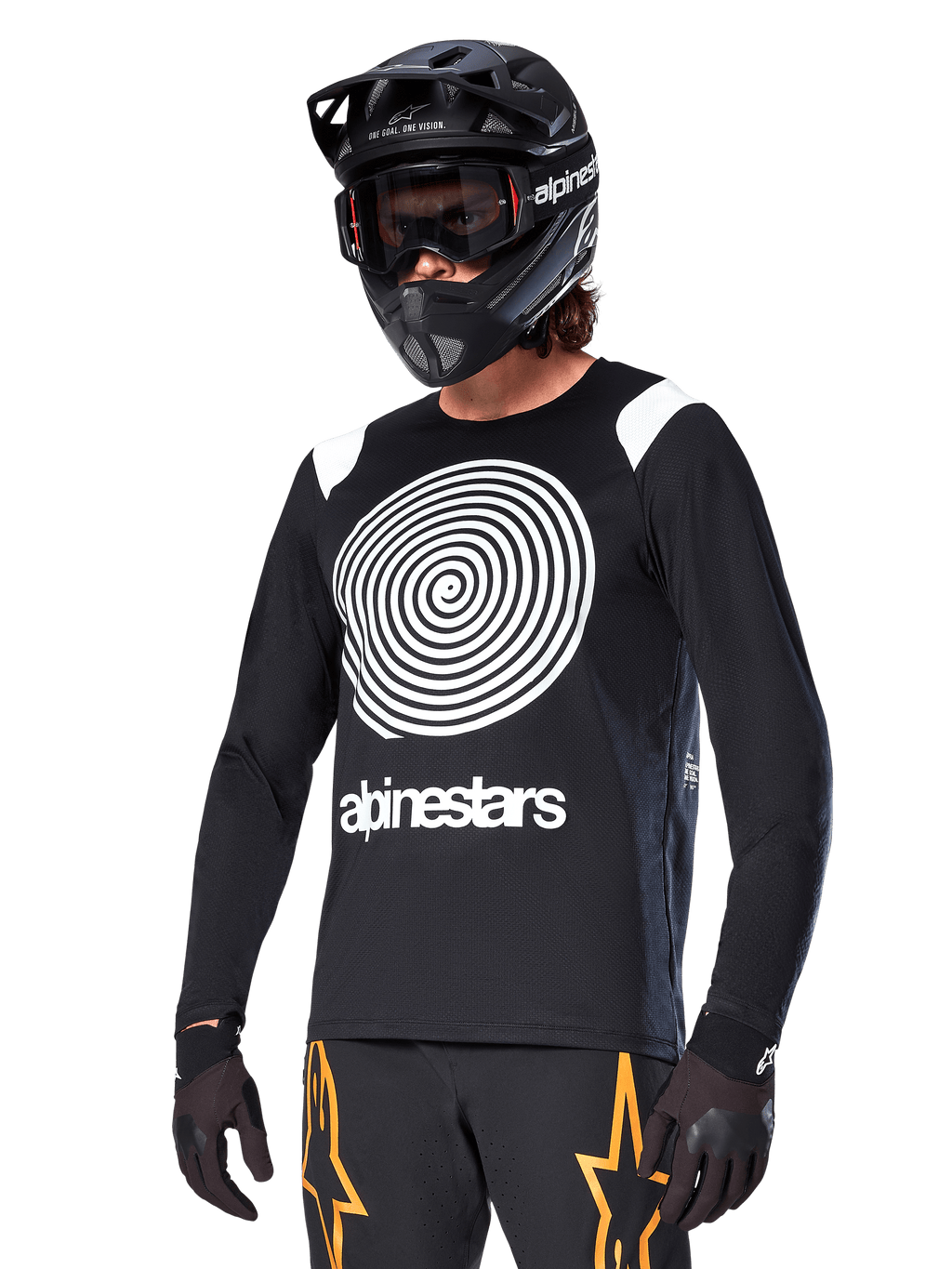 Alpinestars A-Supra Oscar Long Sleeve Jersey, MTB Cycling Jersey, Black and White, featuring a bold white spiral design and Alpinestars logo on the chest, worn with a black full-face helmet and goggles, performance mountain biking apparel