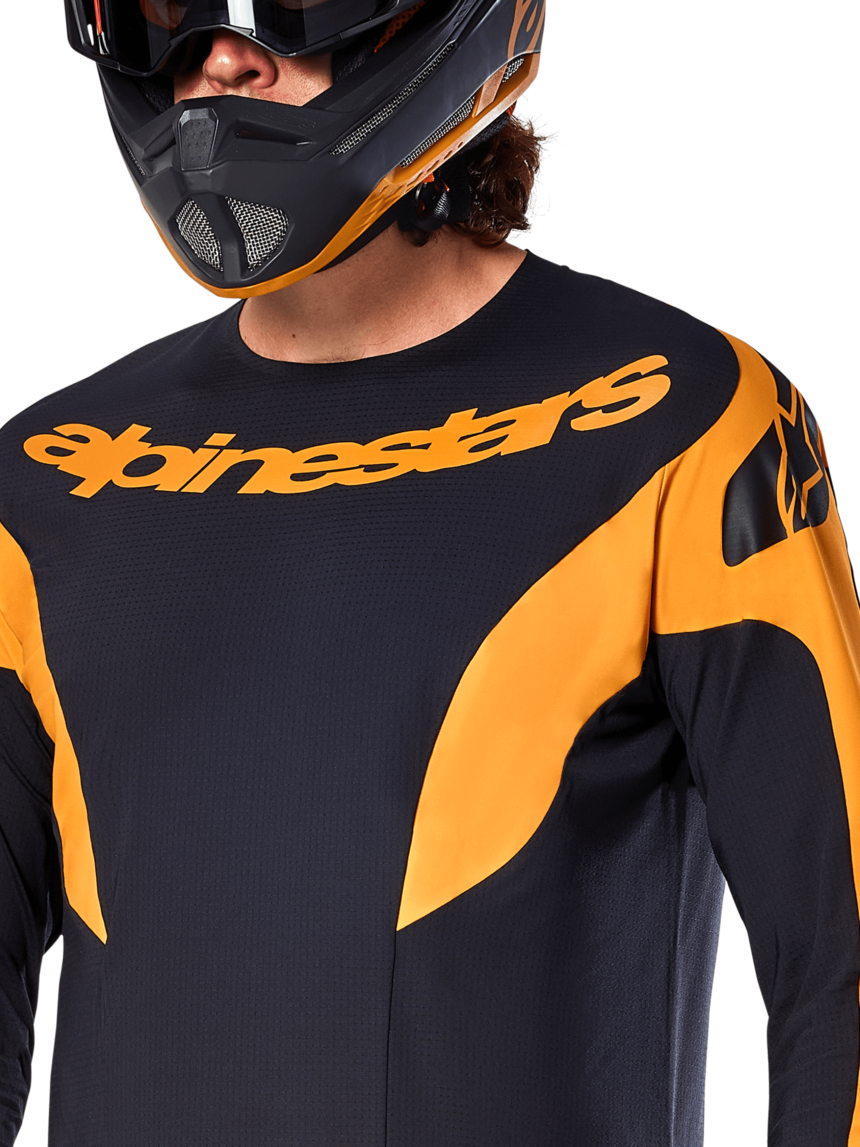 Alpinestars A-Supra Race Jersey - Long Sleeve, Black with orange graphic panels, large orange Alpinestars wordmark on chest, shown on a rider wearing a matching black and orange full-face helmet, performance MTB racing apparel