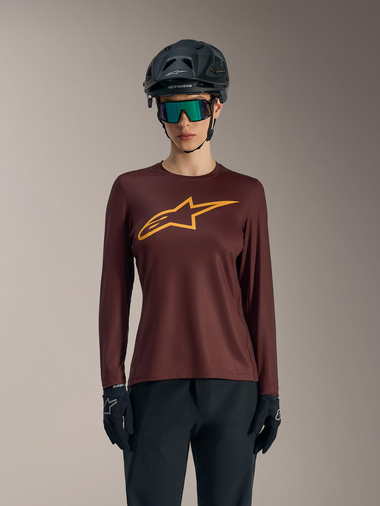 Women's Stella A-Dura Ride Long Sleeve Jersey in Bordeaux, featuring yellow chest logo and casual mountain bike styling.