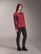 Alpinestars Women Stella A-Dura Dri Astar Long Sleeve Jersey, Burgundy red with black chest logo and black mesh panels on the sleeves, worn with black technical pants and black riding shoes, high-performance mountain bike apparel for women