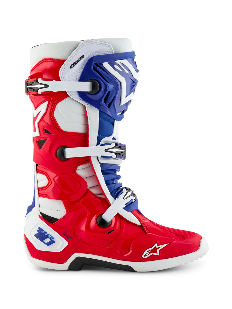 Alpinestars Limited Edition Fortitude Tech 10 Boot, Motocross Boot, Bright Red White and Blue patriotic design, side view featuring triple buckle closure, protective TPU shell, and Alpinestars logo on the toe, elite performance off-road footwear