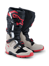 Alpinestars 2026 Tech 7 Enduro Boots, Motocross and Enduro Boots, Black Light Gray and Bright Red, featuring a four-buckle closure system, TPU shin protection with red star logo, and a rugged red sole for off-road performance
