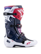Alpinestars Tech 10 Supervented Boots, Motocross Racing Boots, Night Navy White Rainbow colorway, side profile view, featuring navy blue and white shell with red accents, black buckle straps, and a purple to red gradient at the top cuff, high-performance ventilated construction for off-road racing protection