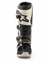 Alpinestars 2026 Tech 7 Enduro Drystar® Boots, Black Dark Gray and Gold, waterproof off-road motorcycle boots, front view featuring multi-buckle closure system with gold accents, TPU shin protection, and star logo design.
