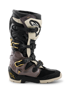 Alpinestars 2026 Tech 7 Enduro Drystar® Boots, Motocross and Enduro Boots, Black Dark Gray and Gold, featuring a multi-buckle closure system with gold accents, rugged dual-compound sole, and durable TPU protective panels, professional off-road riding footwear