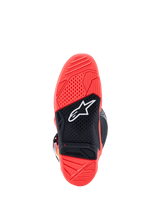 Alpinestars Tech 7 Boots, Outsole view, Bright Fluorescent Red and Black, featuring a textured dual-compound rubber sole with a white Alpinestars star logo and a wear limit indicator