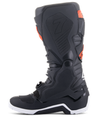 Alpinestars Tech 7 Enduro Boots, Black and Red Fluo, medial profile view featuring honeycomb grip panels and white sole, high-performance off-road motorcycle boots