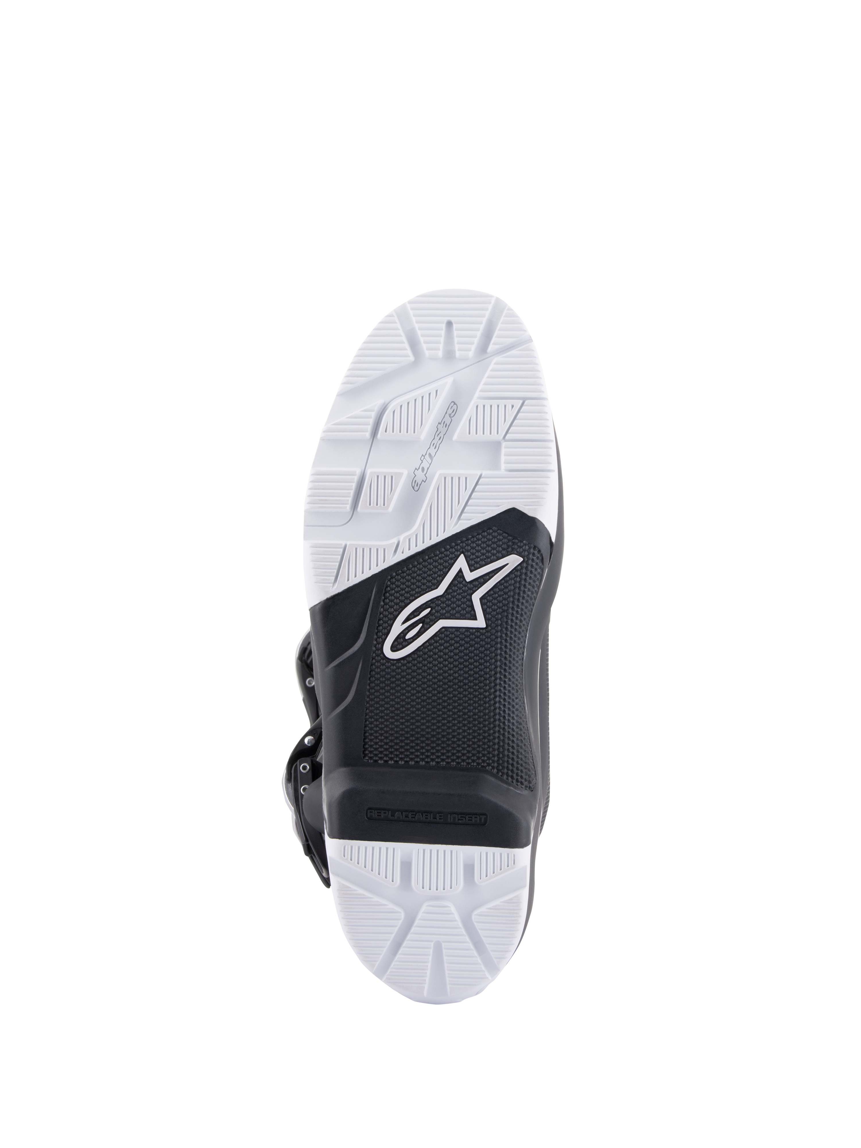 Alpinestars Tech 7 Enduro Boots, sole view showing the specifically engineered compound outsole, black and white dual-tone design with textured grip patterns, featuring the white star logo and a replaceable footpeg insert.