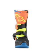 Alpinestars Kids Tech 3S Boots, Motocross Boots, Orange Fluo, Enamel Blue, and Yellow Fluo, front view featuring an orange shin plate with a yellow star logo, black buckle closures, and a blue sole, protective off-road footwear for youth riders