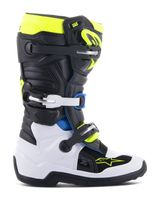 Alpinestars Youth Tech 7S Boots, Motocross Boots, Black Enamel Blue and Fluorescent Yellow, featuring a white lower foot shell, black upper with vibrant accents, buckle closure system, and durable off-road construction for junior riders