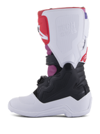 Alpinestars Youth Tech 7S Boots, Motocross Boots, White Black Rainbow, medial side view featuring white shin plate with embossed Tech Series logo, black lower section, and vibrant pink and red accents, durable protective gear for youth off-road riding